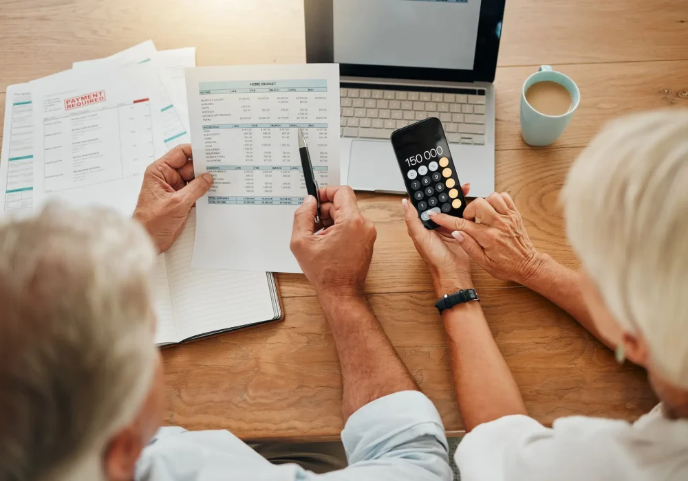 Home budget, finance planning and senior couple calculating their expenses, bills or income during